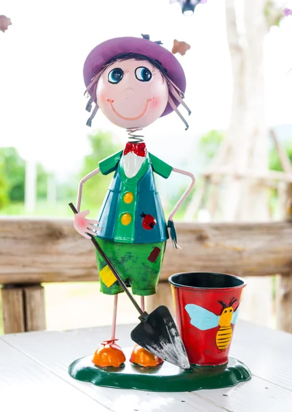 Cute smile doll with a beautiful basket on dining table — Stock Photo, Image