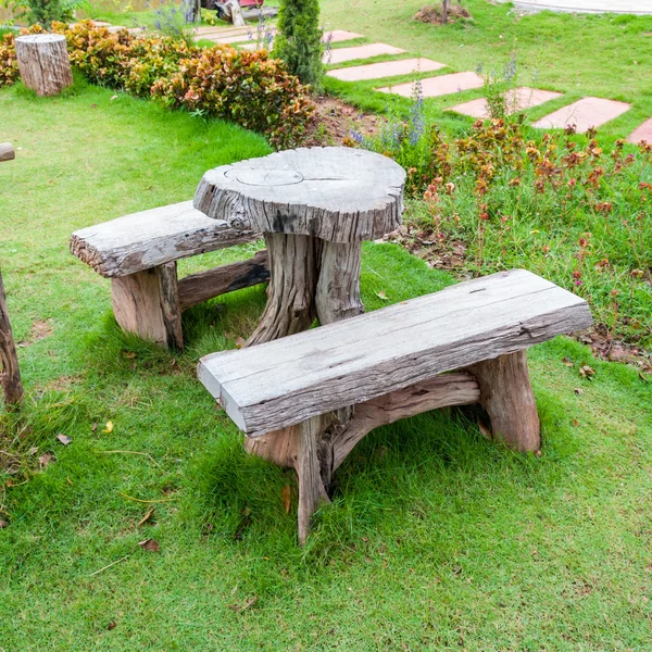 The empty wooden table and bench in garden or park — Stock Photo, Image