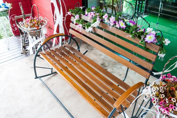 Wooden Bench around with colorful flowers — Stock Photo, Image