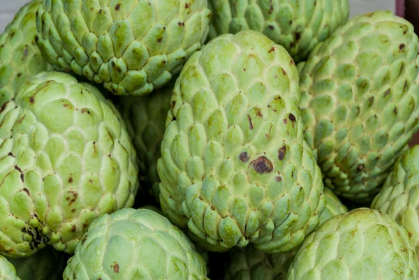 Fresh organic custard apples for sale at a market Royalty Free Stock Images