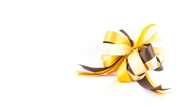 Gouden of gele ribbon bow geïsoleerd op een witte achtergrond - één geschenk boog, gouden satijn — Stockfoto