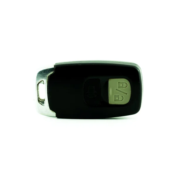 Bilnyckel med remote-knappar på vit bakgrund - tändningen med fjärrkontroll — Stockfoto