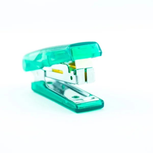 Green transparent stapler isolated on a white background — Stock Photo, Image