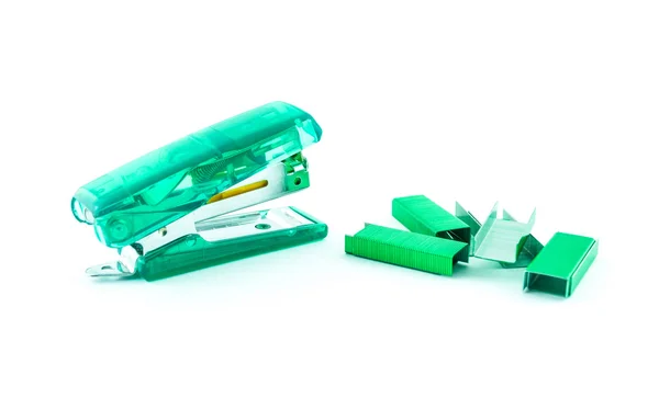 Green stapler and bunch of staples isolated on white — Stock Photo, Image