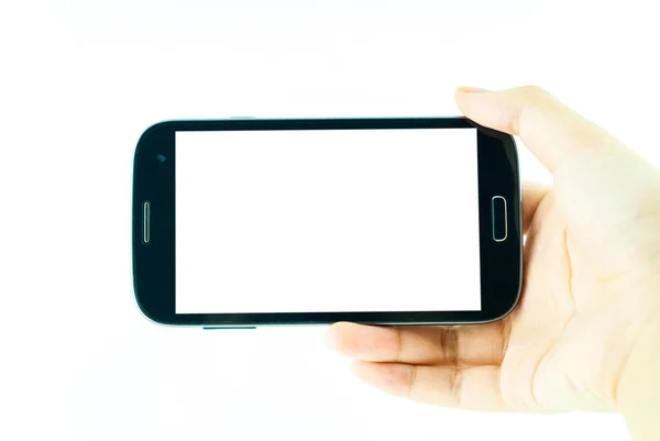 Cell phone with touchscreen in female hand on white background - female hand is holding a modern touch screen phone - blank white screen Stock Picture