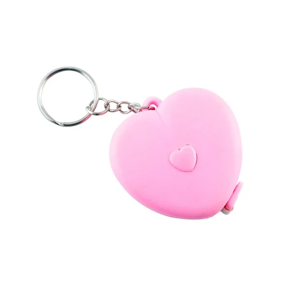 Baratija plástica para las llaves como corazón, aislada en blanco —  Fotos de Stock