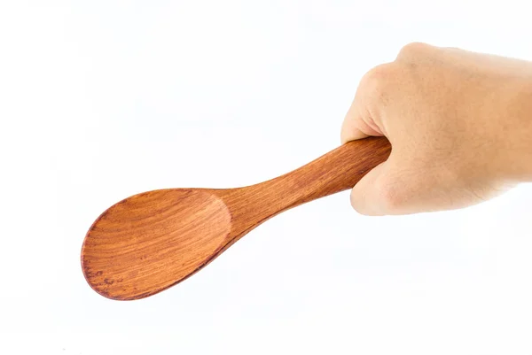 Wooden Spoon in hand Isolated on a white background — Stock Photo, Image