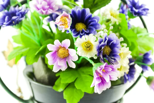 Decorative the artificial flowers in pot isolated on white — Stock Photo, Image