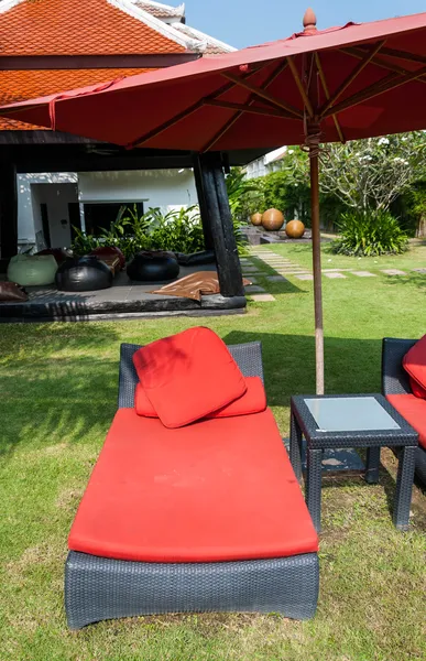 Beach red chair bed near the swimming pool — Stock Photo, Image