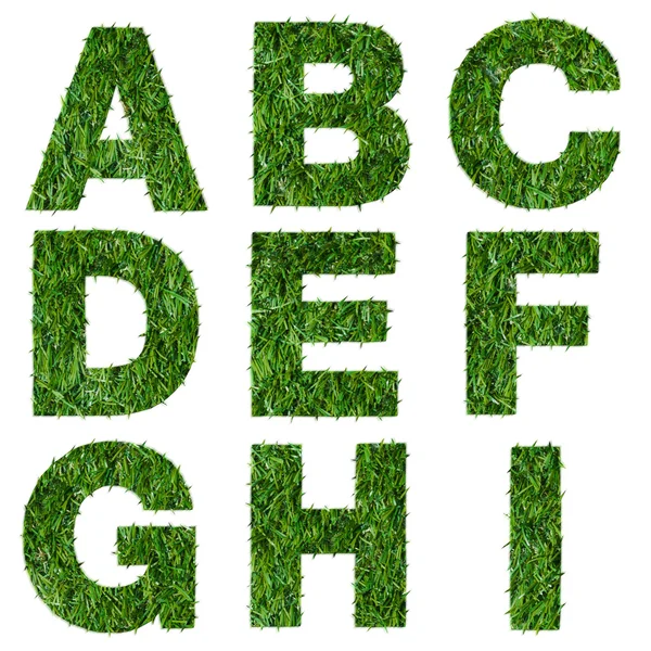 Буквы a, b, c, d, e, f, g, h, i сделаны из зеленой травы, изолированной на белом — стоковое фото