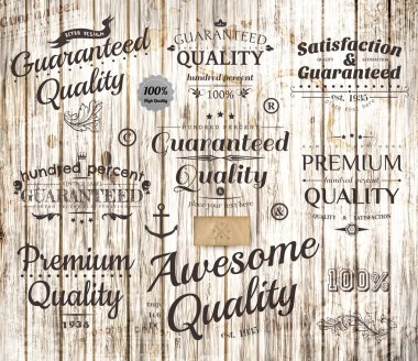 Vector set of calligraphic design elements, page decoration, Premium Quality and Satisfaction Guarantee Label collection, Vintage wood background