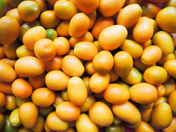 Ripe orange kumquat background close up — Stock Photo, Image