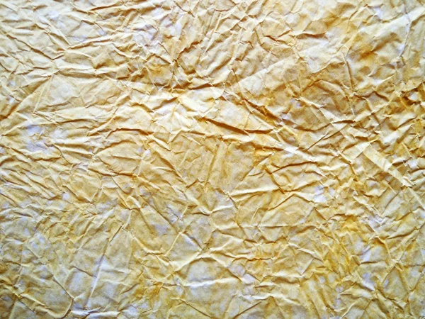 Gele gevouwen papier — Stockfoto