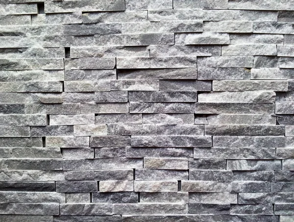 Muro di pietra nero — Foto Stock