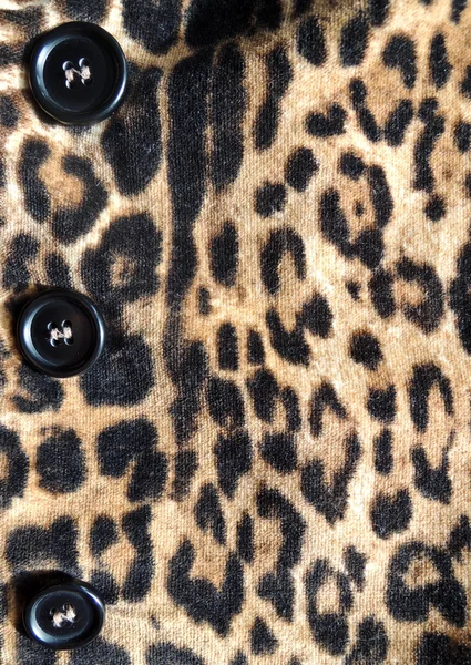 Close-up of a stylish leopard jacket with black button — Stock Photo, Image