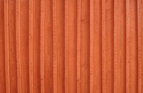 Background image of a wooden wall painted in bright red color — Stock Photo, Image