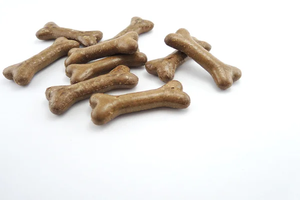 Galleta de comida para perros con forma de huesos aislados sobre fondo blanco —  Fotos de Stock