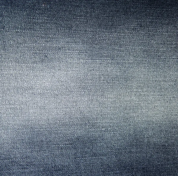 Ткань темных джинсов с видимой структурой в качестве фона — стоковое фото