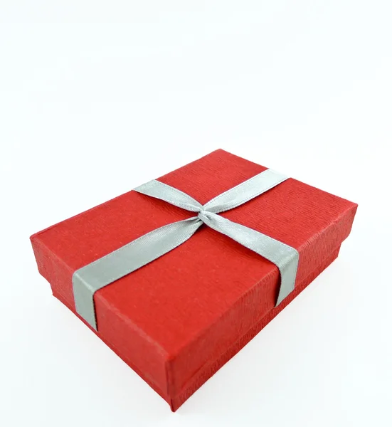 Red box and ribbon on white backgrounds — Stock Photo, Image