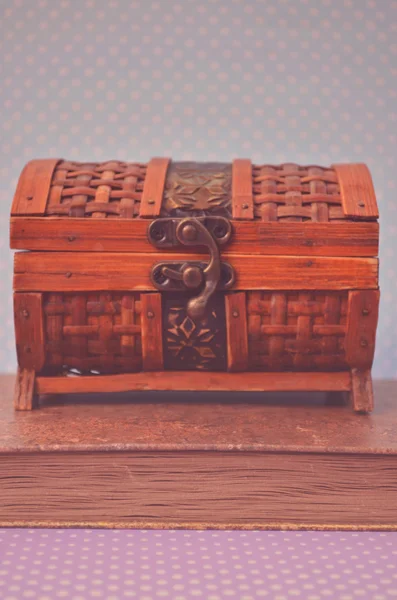 Decorative chest box on old book