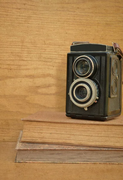 Vintage camera on book — Stock Photo, Image