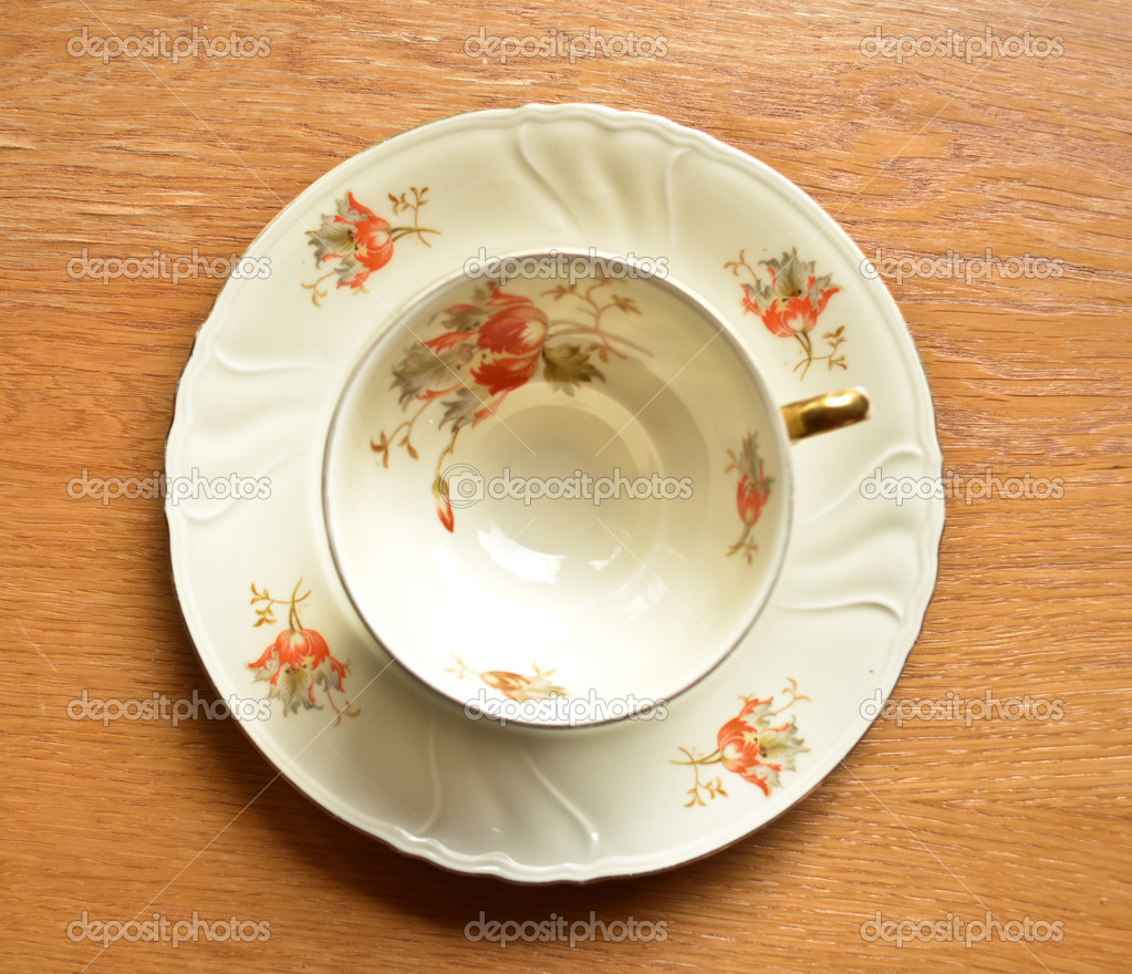 Empty cup of tea on wooden background