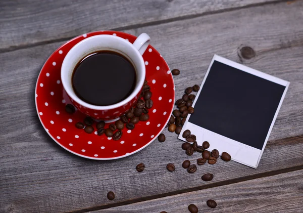 Coffee and photo paper on wooden — Stock Photo, Image