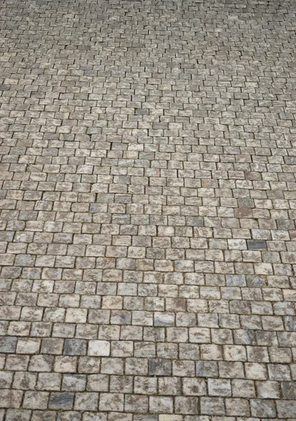 Granit kullerstensbelagd trottoaren bakgrund — Stockfoto