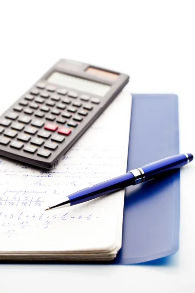 A pen, a scientific calculator and notepad of maths — Stock Photo, Image