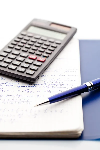 Isolated pen, a scientific calculator and notepad of maths — Stock Photo, Image