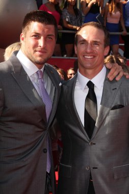 Tim Tebow, Drew Brees