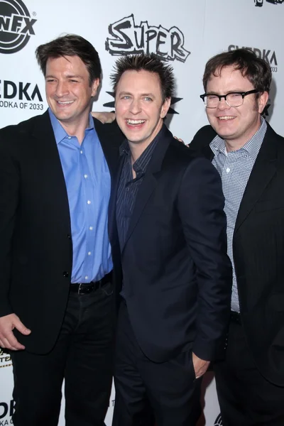Nathan Fillion, James Gunn og Rainn Wilson. - Stock-foto