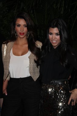 Kim Kardashian and Kourtney Kardashian at the QVC Red Carpet Style Party, Four Seasons Hotel, Los Angeles, CA. 02-25-11