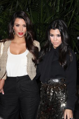 Kim Kardashian and Kourtney Kardashian at the QVC Red Carpet Style Party, Four Seasons Hotel, Los Angeles, CA. 02-25-11