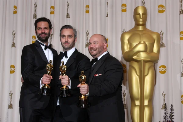 Emile Sherman, Iain Canning y Gareth Unwin en la 83ª Sala de Prensa Anual de los Premios Óscar, Kodak Theater, Hollywood, CA. 02-27-11 — Foto de Stock
