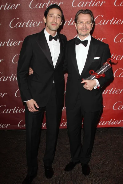 Adrien Brody y Gary Oldman en la 23ª Gala Anual de Premios del Festival Internacional de Cine de Palm Springs, Palm Springs Convention Center, Palm Springs, CA 01-07-12 — Foto de Stock