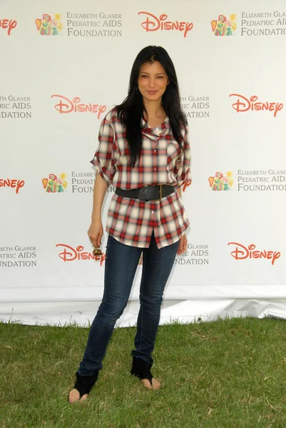 Kelly Hu på 2010 A Time For Heroes Celebrity Picnic, Wadsworth Theater, Los Angeles, CA. Tilsætningsstoffets sammensætning - Stock-foto