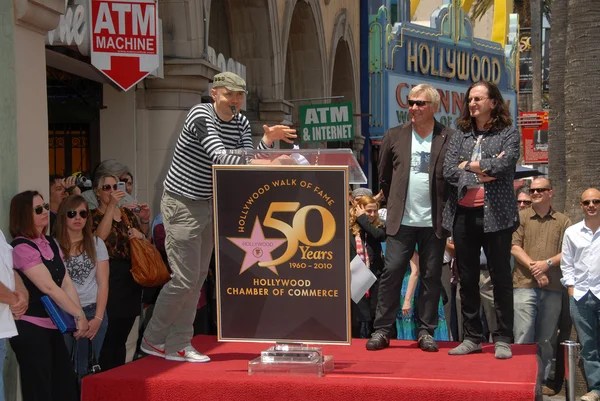 Billy Corgan, Alex Lifeson og Geddy Lee. - Stock-foto