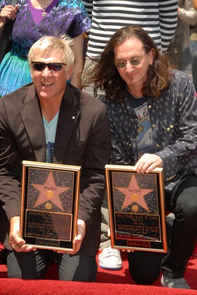 Alex Lifeson and Geddy Lee at the induction ceremony for RUSH into the Hollywood Walk of Fame, Hollywood, CA. 06-25-10 — Stock Photo, Image