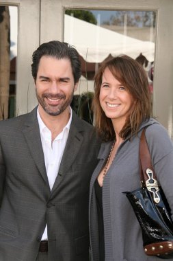 Eric McCormack and Janet Holden at the 7th Annual Stuart House Benefit. John Varvatos Boutique, Beverly Hills, CA. 03-08-09