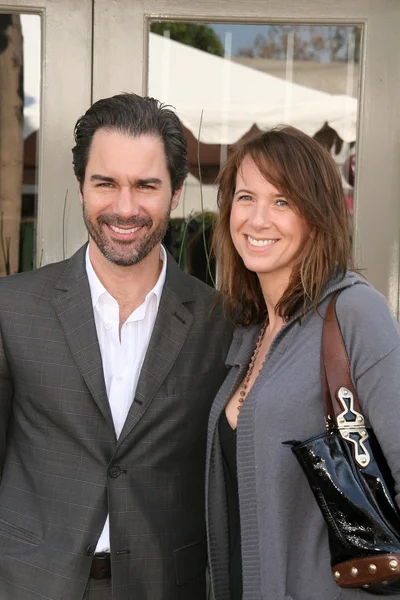 Eric McCormack and Janet Holden at the 7th Annual Stuart House Benefit. John Varvatos Boutique, Beverly Hills, CA. 03-08-09 — Stok fotoğraf