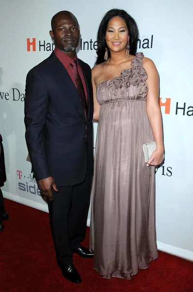 Djimon Hounsou e Kimora Lee al gala pre-Grammy Salute To Icons Clive Davis. Beverly Hilton Hotel, Beverly Hills, CA. 02-07-09 — Foto Stock