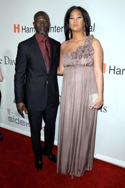 Djimon Hounsou y Kimora Lee en la Gala Pre-Grammy Salute To Icons Clive Davis. Beverly Hilton Hotel, Beverly Hills, CA. 02-07-09 — Foto de Stock