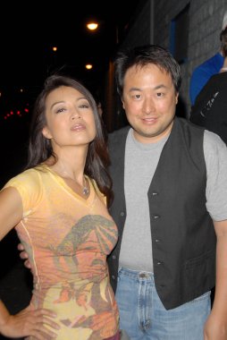 Ming-Na and Eric Michael Zee at Robot Chicken's Skate Party Bus Tour. Skateland, Northridge, CA. 08-01-09