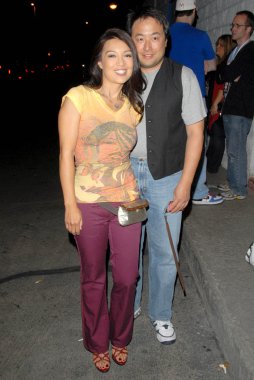 Ming-Na and Eric Michael Zee at Robot Chicken's Skate Party Bus Tour. Skateland, Northridge, CA. 08-01-09