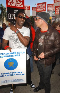 Isaiah Washington and Justin Chambers at the Writers Guild of America Picket Line in front of Paramount Studios. Hollywood, CA. 12-12-07