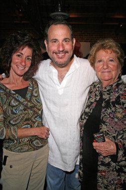 Malcolm Danare with his sister and mother