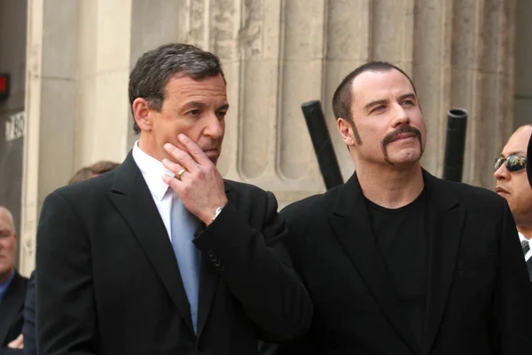 Bob Iger, John Travolta — Stok fotoğraf