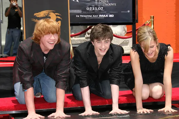 Rupert Grint com Daniel Radcliffe e Emma Watson — Fotografia de Stock