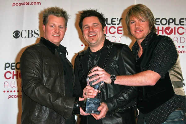 Gary levox met jay demarcus en joe don rooney — Stockfoto